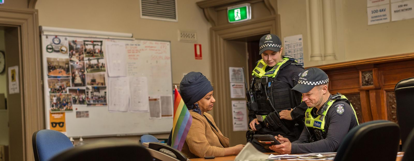 GLLO officers speaking with a community member