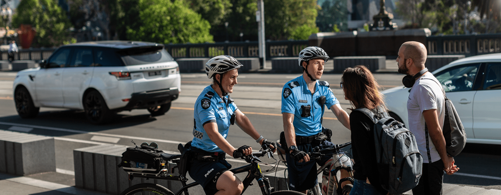 Bike patrol unit speak with pedestrians