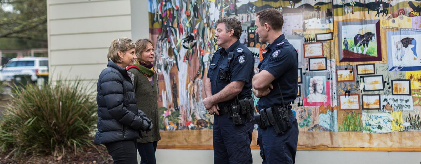 Police officers speaking with community members