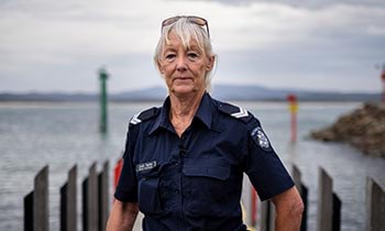 Police officer on the shores at Mallacoota