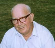 Photo of Joseph Shackleton wearing glasses and smiling