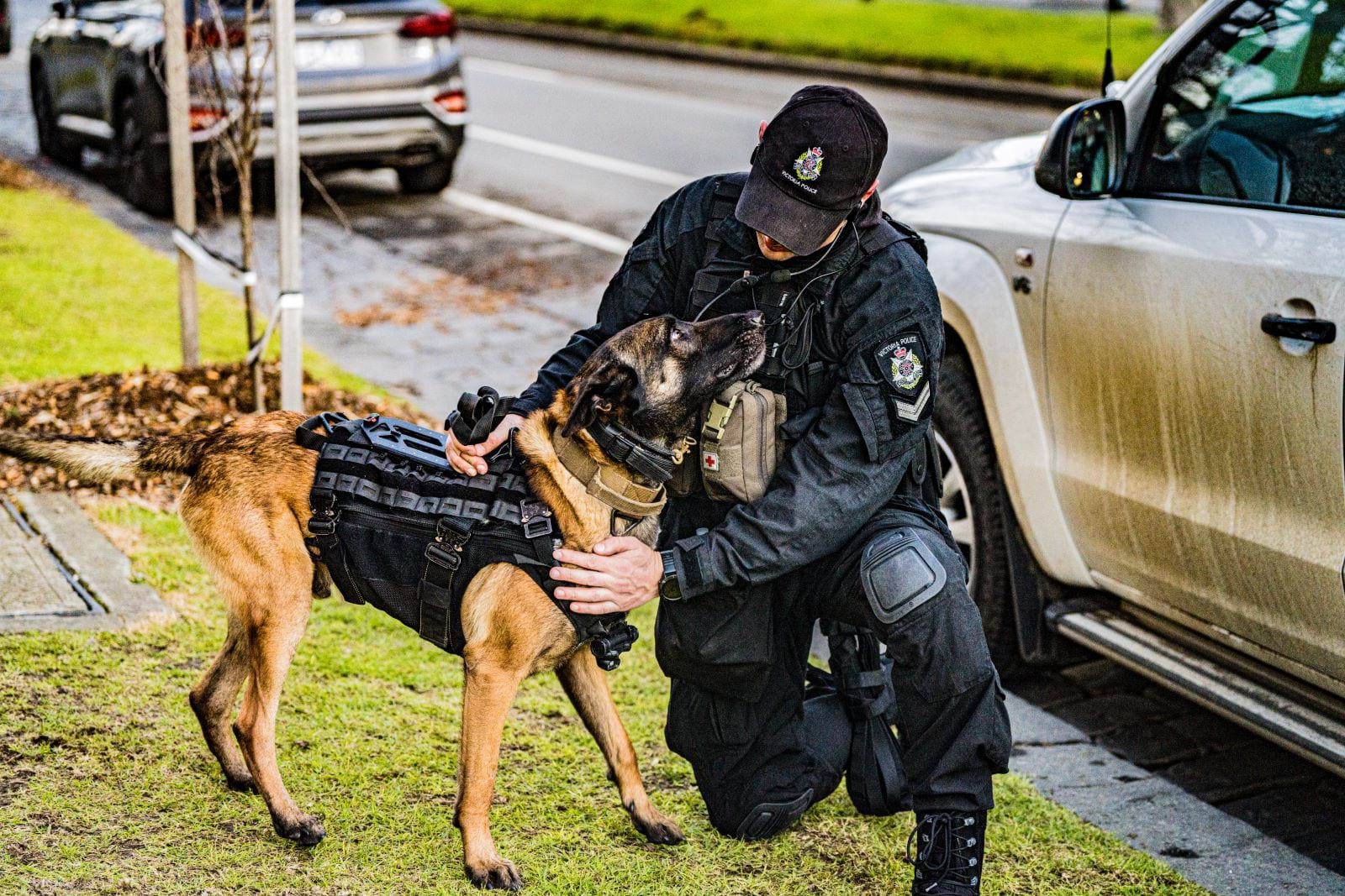 Member of the dog squad handling a police dog. 