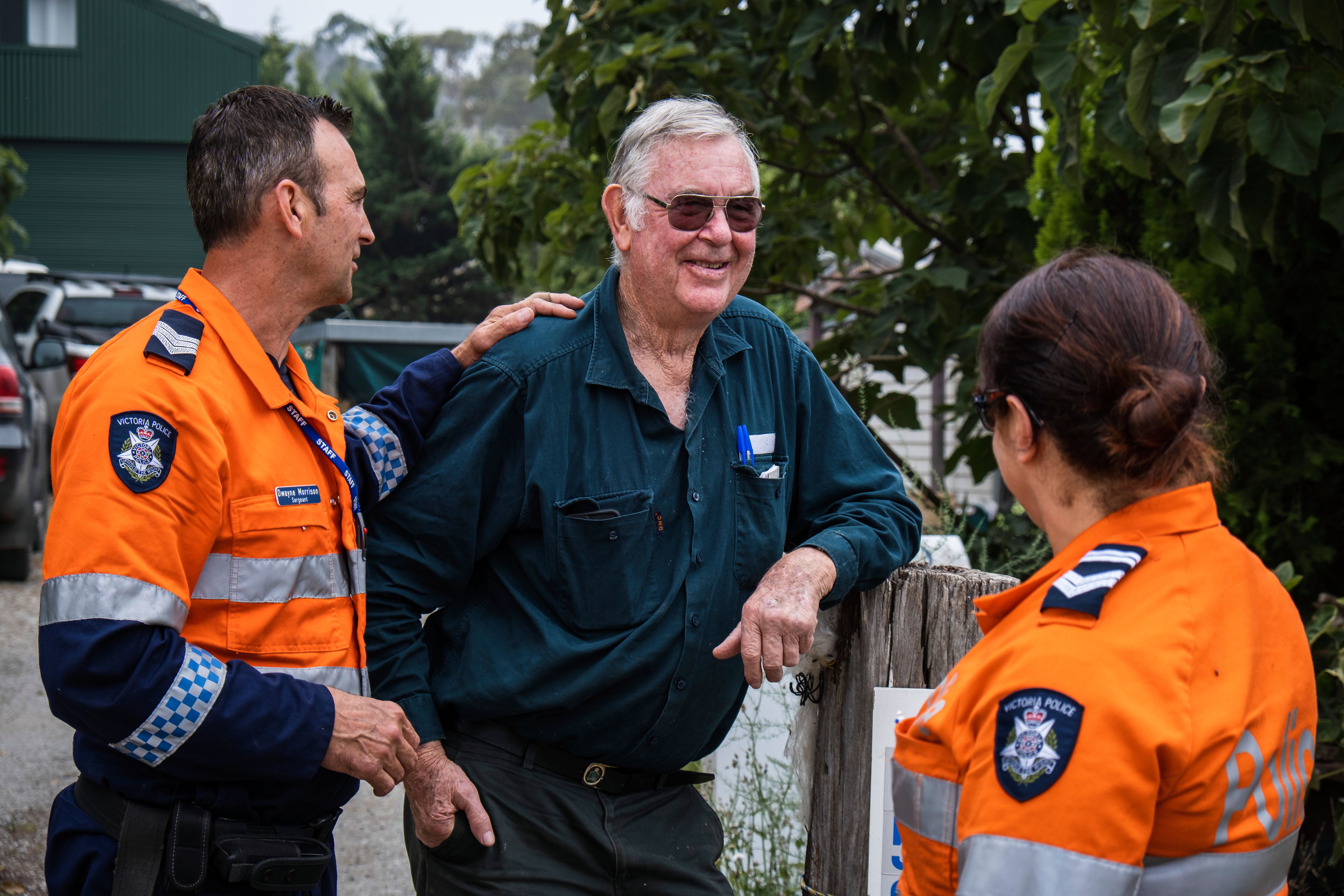 Victorian bushfires 2019-2020 - Two police officers chatting to a smiling community member