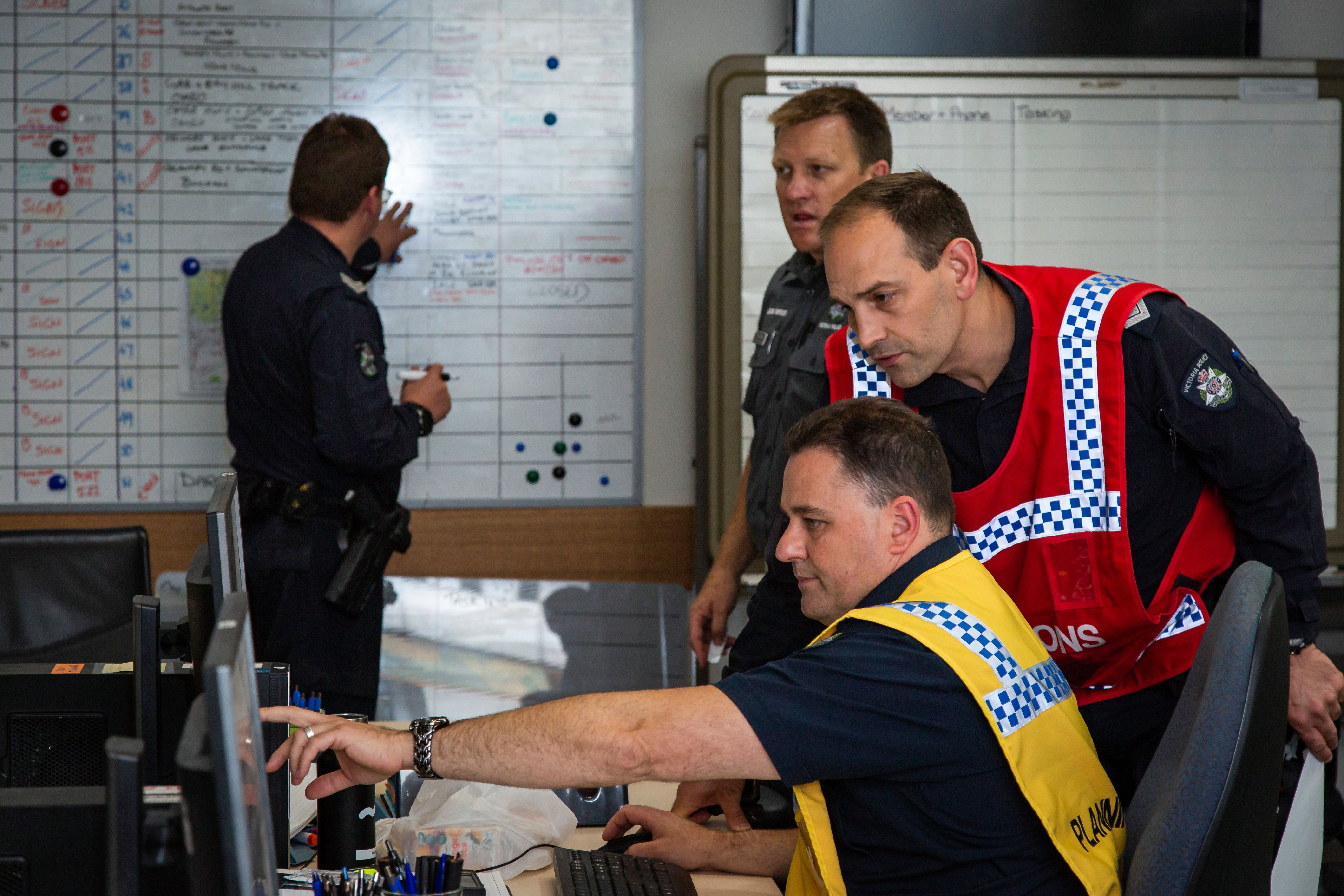 Victorian bushfires 2019-2020 - Police officers and emergency services discussing plan of action 