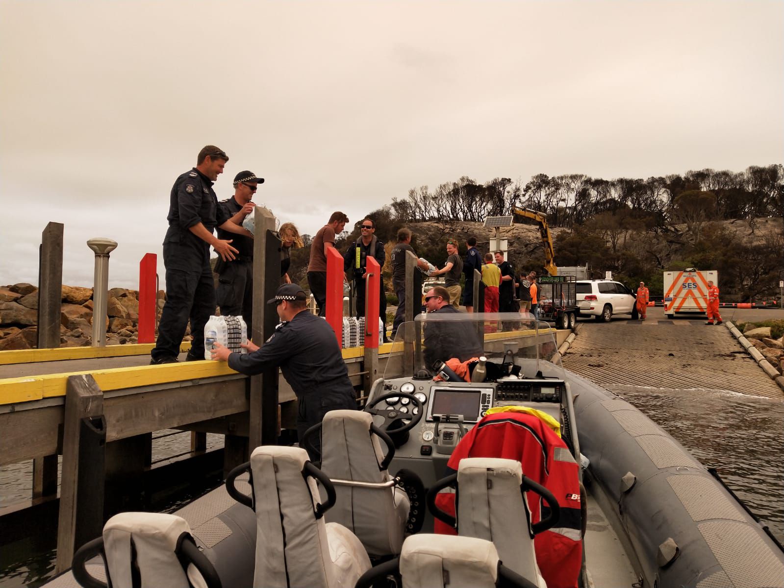 Victorian bushfires 2019-2020 - Docked police dinghy delivering supplies to community