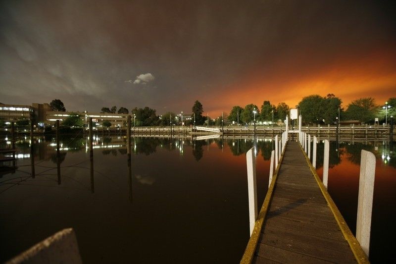 Victorian bushfires 2019-2020 - Marina pier with black and orange sky background