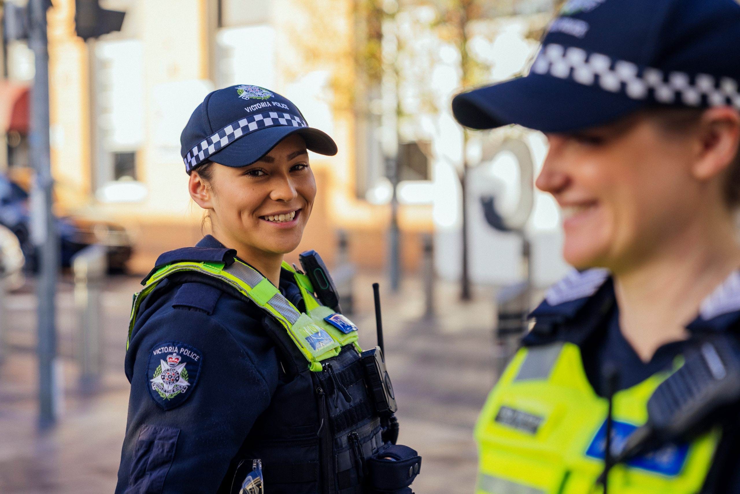 Police officer careers - Apply to be a police officer - Two general duties officers outside smiling