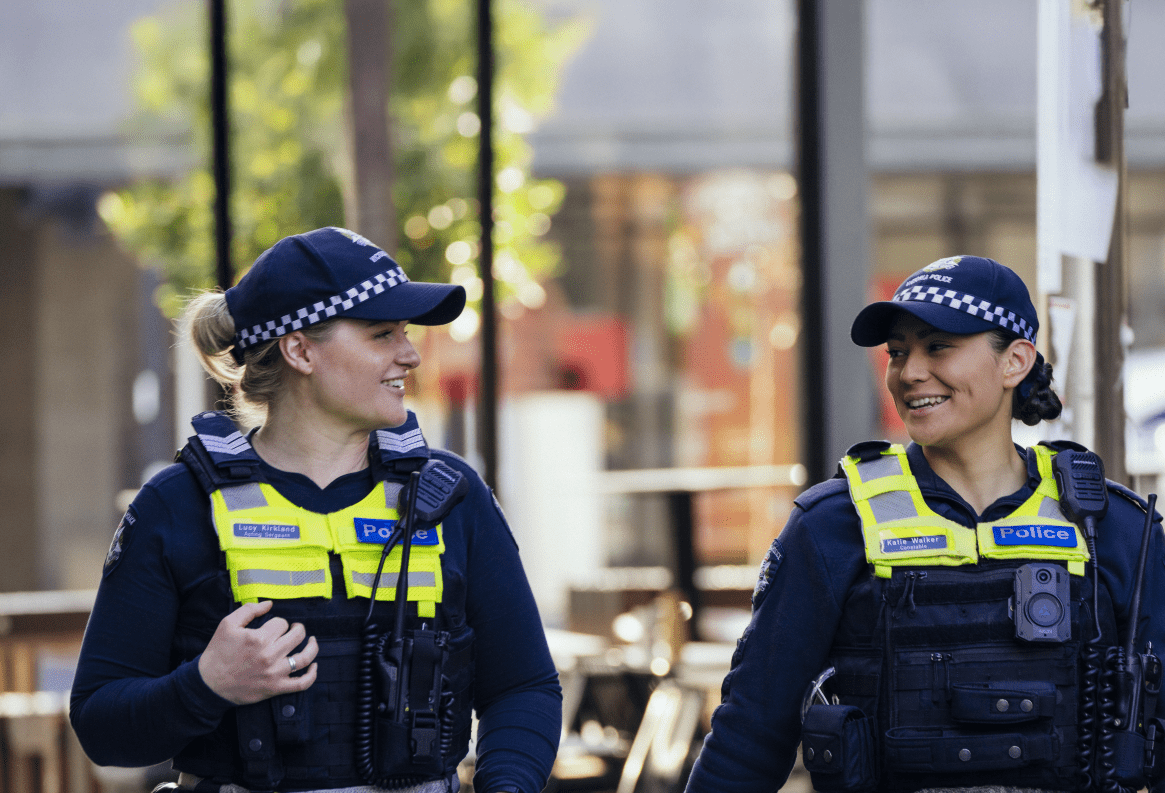 Two female police officers in uniform. 