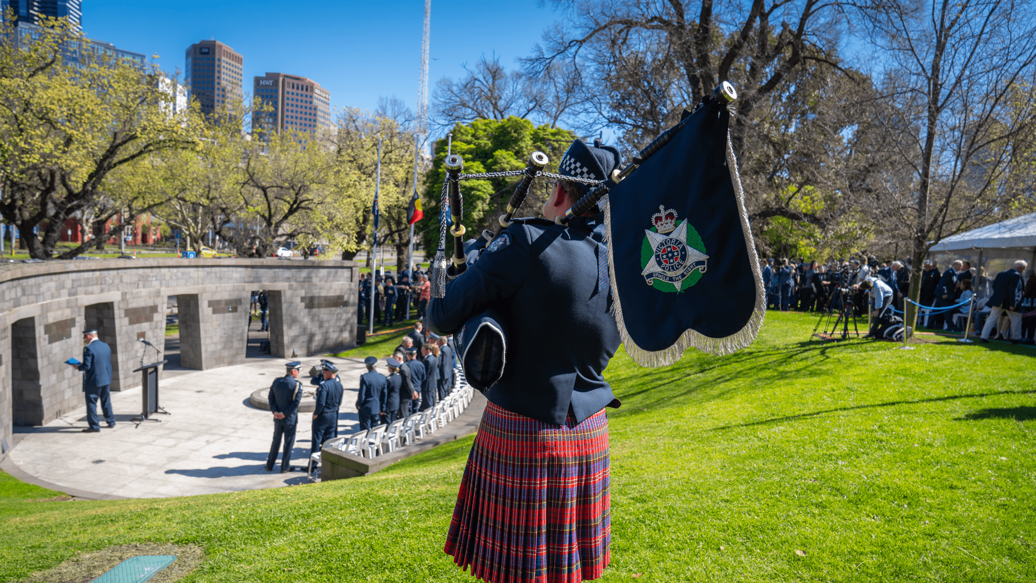 Victoria Police Band members plays bagpipes at the Police Memorial.