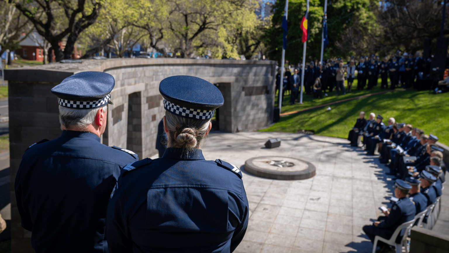 Victoria Police officers pay their respects at the Police Memorial.