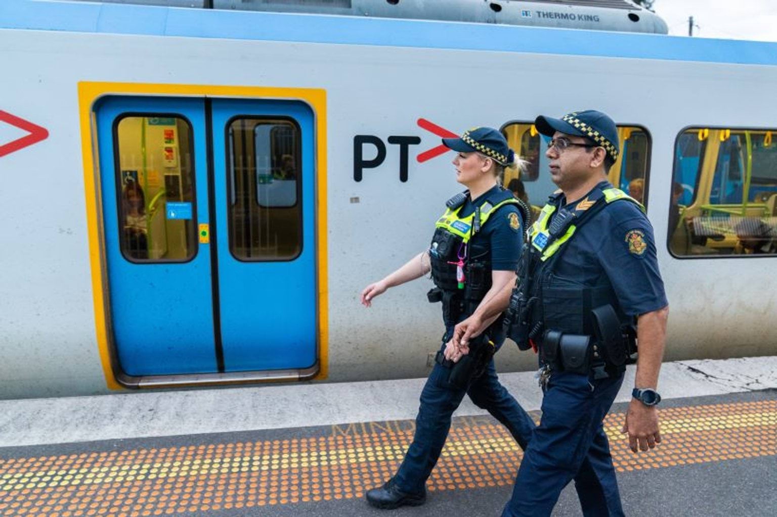 Two PSOs patrolling the train station.